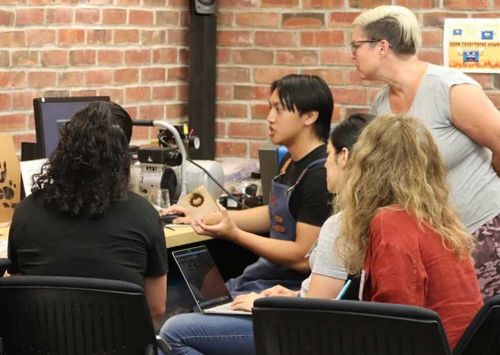small group of students working directly with instructor